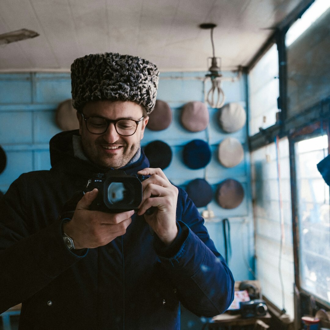 Portrait of a male camera operator with a video camera