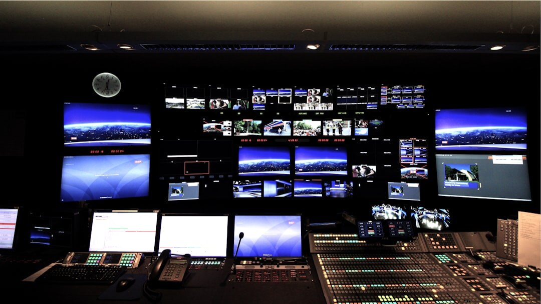 Modern television control room with multiple monitors